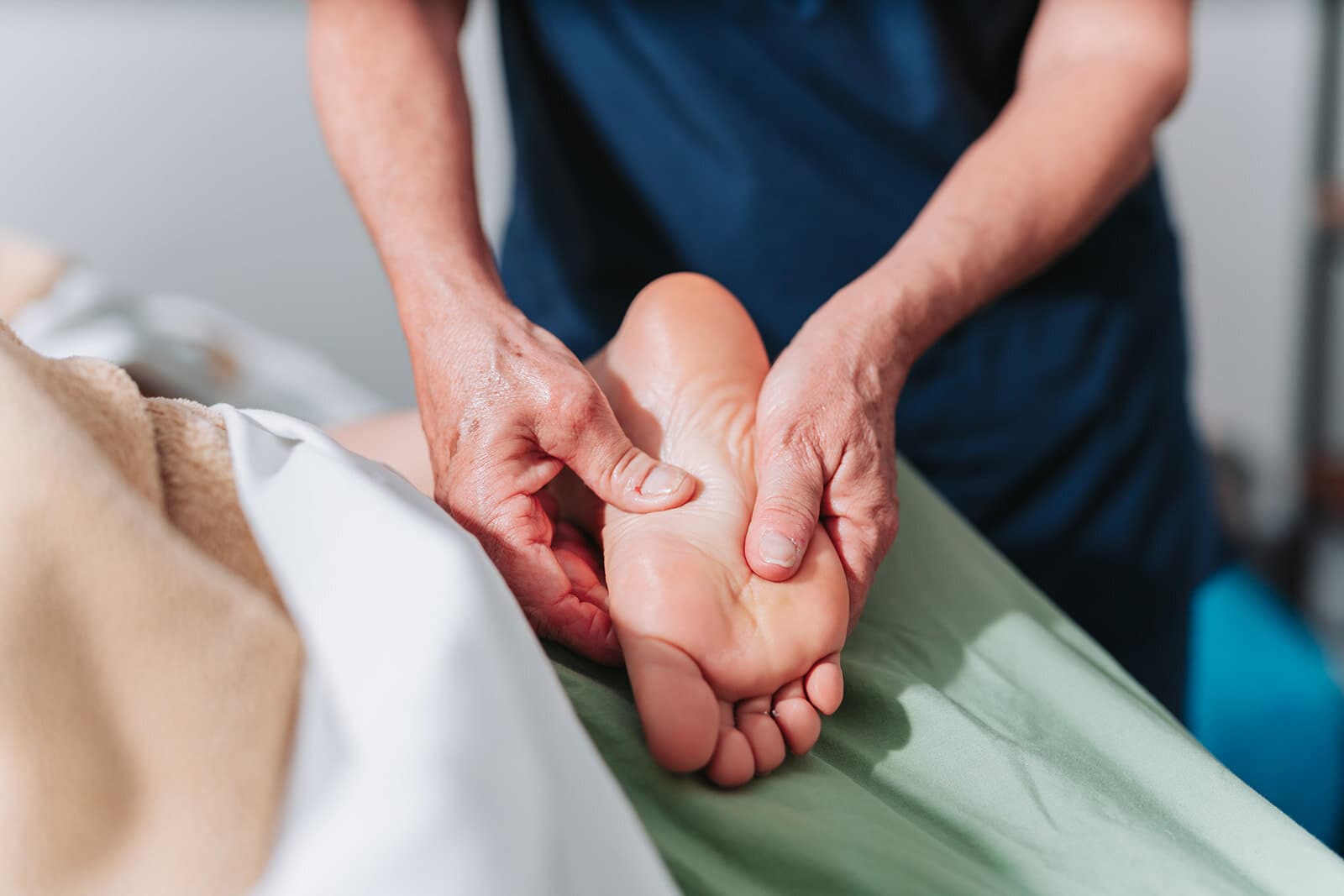 Close-up of an ankle and foot extremity adjustment at Foudy Chiropractic