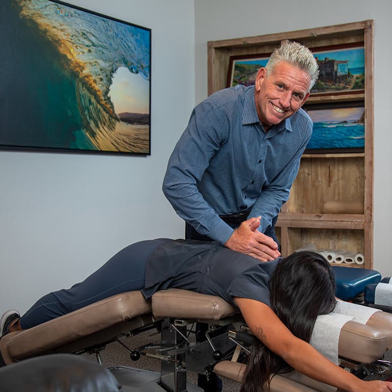 Dr. Foudy adjusting a patient's lower back at Foudy Chiropractic