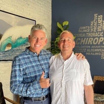 Dr. Foudy with a smiling patient after treatment