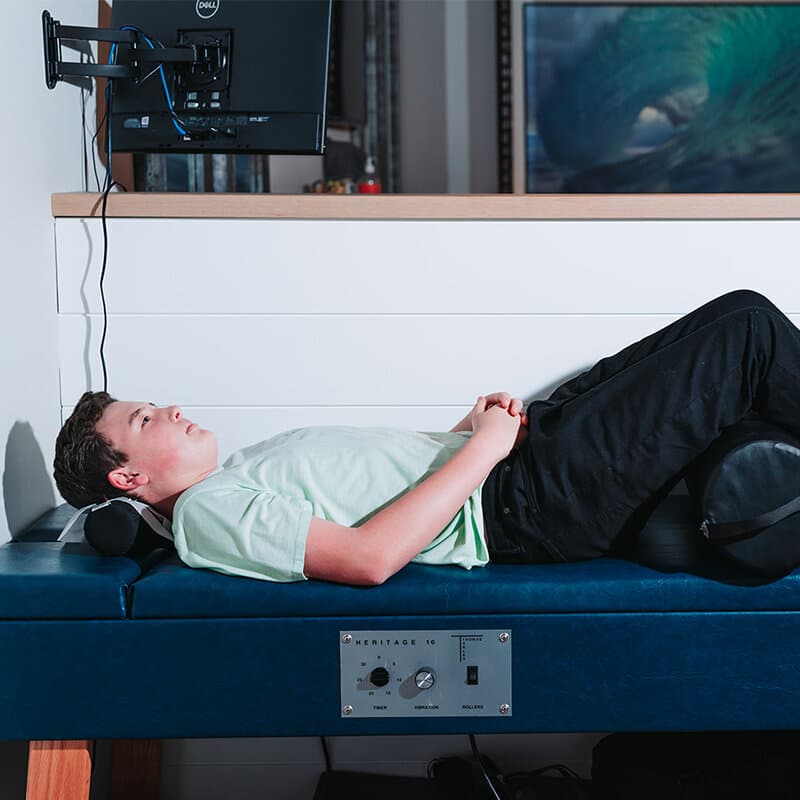 Patient receiving AccuSpina IDD spinal decompression therapy in Mission Viejo